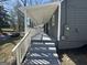 Inviting covered porch with gray painted steps and white railings, offering a relaxing outdoor space at 1457 Richland Sw Rd, Atlanta, GA 30310