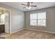 Bedroom with carpet, ceiling fan, and a window providing natural light; bathroom access to the left at 976 Buckhorn Bnd, Locust Grove, GA 30248