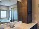 Bathroom featuring a shower, bathtub, large mirror, and abundant storage at 232 Darwish Dr, Mcdonough, GA 30252