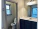 Bathroom featuring a toilet, vanity, and bathtub, providing ample space for hygiene and relaxation at 232 Darwish Dr, Mcdonough, GA 30252