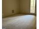 Bright bedroom with carpet and door leading to the outside at 232 Darwish Dr, Mcdonough, GA 30252