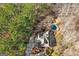 Overhead aerial view of a house surrounded by mature trees in a wooded area at 417 Harper Rd, Mcdonough, GA 30252