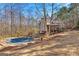 Backyard view of a multi-story home with a covered pool and a spacious deck at 417 Harper Rd, Mcdonough, GA 30252