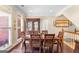 Elegant dining room with hardwood floors, crown molding, and a china cabinet for display at 417 Harper Rd, Mcdonough, GA 30252