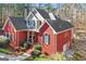 Stunning two-story red brick home featuring a covered front porch and a well-manicured yard at 417 Harper Rd, Mcdonough, GA 30252