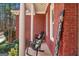 Inviting front porch with rocking chairs, brick floors, and a 'Welcome' sign for a cozy feel at 417 Harper Rd, Mcdonough, GA 30252
