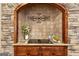Close-up of kitchen stone alcove featuring countertop, backsplash, cooktop, and decorative elements at 417 Harper Rd, Mcdonough, GA 30252