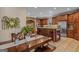 Spacious kitchen featuring a granite countertop island, stainless steel appliances, and tile flooring at 417 Harper Rd, Mcdonough, GA 30252