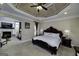 Spacious main bedroom features a decorative ceiling and connects to a cozy sitting area with a fireplace at 415 Oxmoor Lake Dr, Mcdonough, GA 30252