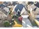 Aerial view of a home showcasing a manicured front yard, driveway, and mature trees at 152 Wexford Ct, Stockbridge, GA 30281