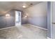 An attic bedroom with blue striped walls, and a bathroom entrance visible in the background at 152 Wexford Ct, Stockbridge, GA 30281