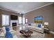 Bright living room featuring a fireplace, a ceiling fan, and a neutral color palette at 152 Wexford Ct, Stockbridge, GA 30281