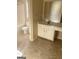 Bathroom showing vanity and toilet with tile floors at 460 Ridgewood Dr, Fayetteville, GA 30215