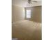Spacious bedroom with plush carpeting and natural light from the window at 460 Ridgewood Dr, Fayetteville, GA 30215