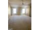 A huge bedroom with two windows and a ceiling fan at 460 Ridgewood Dr, Fayetteville, GA 30215