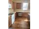 Updated kitchen with stainless steel appliances, wood cabinets, laminate countertops and flooring at 460 Ridgewood Dr, Fayetteville, GA 30215