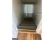 Carpeted staircase with wooden trim transitioning from wood flooring, leading to the upper level at 460 Ridgewood Dr, Fayetteville, GA 30215
