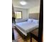 Bedroom boasts a comfortable bed with wooden floors and natural light at 2285 Peachtree Rd # 602, Atlanta, GA 30309