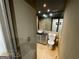 Compact bathroom featuring neutral tile, modern vanity, and essential fixtures at 2285 Peachtree Rd # 602, Atlanta, GA 30309