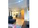 Open concept living area with a modern kitchen in the background at 2285 Peachtree Rd # 602, Atlanta, GA 30309