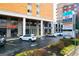 A street view of a building with various businesses and parking spaces in front, offering convenience and visibility at 2285 Peachtree Rd # 602, Atlanta, GA 30309