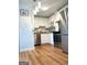 Kitchen featuring stainless steel appliances, white cabinets, and wood floor at 2285 Peachtree Rd # 602, Atlanta, GA 30309