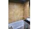 Bathroom with tiled walls, a shower head and a white tub at 2285 Peachtree Rd # 602, Atlanta, GA 30309