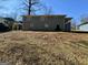 View of the back of the house with a backyard and porch at 791 Gertrude Nw Pl, Atlanta, GA 30318