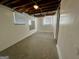 Unfinished basement with exposed ceiling and ductwork, and small window at 791 Gertrude Nw Pl, Atlanta, GA 30318