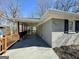 Covered parking and attached walkway lead to the charming exterior with address 791 displayed at 791 Gertrude Nw Pl, Atlanta, GA 30318