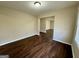 The open living area features a large window and beautiful dark wood floors throughout at 791 Gertrude Nw Pl, Atlanta, GA 30318