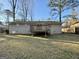 Home's backyard featuring a charming deck, providing a private outdoor space, perfect for relaxing and entertaining at 2205 Chestnut Hill Cir, Decatur, GA 30032