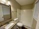 Bathroom featuring a vanity with granite countertops, a toilet, and a walk-in shower at 2205 Chestnut Hill Cir, Decatur, GA 30032