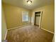 Bedroom with carpet floors and a large window that provides natural light at 2205 Chestnut Hill Cir, Decatur, GA 30032