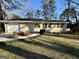 A single Gathering home featuring a well manicured lawn with mature trees at 2205 Chestnut Hill Cir, Decatur, GA 30032
