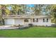 Charming brick home with a well-manicured lawn and beautiful landscaping at 2205 Chestnut Hill Cir, Decatur, GA 30032