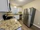 Modern kitchen with stainless steel appliances and granite countertops at 2205 Chestnut Hill Cir, Decatur, GA 30032