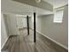 This basement has neutral walls and flooring with black beams, plus doors leading to various rooms at 2690 Rollingwood Se Ln, Atlanta, GA 30316