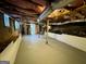 Unfinished basement showing rafters, duct work, concrete floor, and support beam at 2690 Rollingwood Se Ln, Atlanta, GA 30316