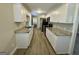 Bright kitchen featuring granite countertops, white cabinets, and stainless steel appliances at 2690 Rollingwood Se Ln, Atlanta, GA 30316