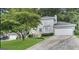 Charming two-story home with a well-maintained front yard and attached two-car garage at 6380 Phillips Pl, Lithonia, GA 30058