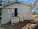 Back entrance featuring a concrete stoop and a black metal handrail at 1965 Rollingwood Se Dr, Atlanta, GA 30316
