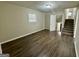 Basement area features new flooring and access to the upper floors via the staircase at 1965 Rollingwood Se Dr, Atlanta, GA 30316