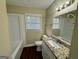 Bathroom featuring new granite vanity, neutral paint, and a shower-tub combination at 1965 Rollingwood Se Dr, Atlanta, GA 30316