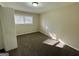 Cozy bedroom with new carpet, a large window for natural light, and neutral paint at 1965 Rollingwood Se Dr, Atlanta, GA 30316