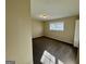 Bedroom featuring clean carpet, neutral paint, and a large window for natural light at 1965 Rollingwood Se Dr, Atlanta, GA 30316