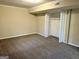 This bedroom features neutral-colored walls, plush carpet and has an ample closet space at 1965 Rollingwood Se Dr, Atlanta, GA 30316