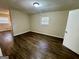 Living room featuring wood vinyl flooring, neutral-colored walls and a window providing natural light at 1965 Rollingwood Se Dr, Atlanta, GA 30316
