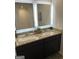 Bathroom featuring double vanity with stylish mirrors and granite countertops at 742 Great Oak Pl # 13, Villa Rica, GA 30180