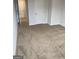 Spacious bedroom featuring plush carpeting and ample natural light from the windows at 742 Great Oak Pl # 13, Villa Rica, GA 30180